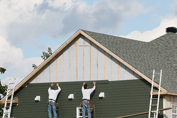 Professional Siding Installation technician working in Fredericksburg, OH